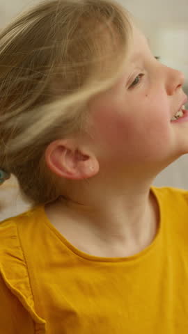 Upset Caucasian little girl child kid daughter covering ears shaking head no in refusal gesture feeling annoyed stressed at home baby angry scared emotional reaction refusing to listen noise problem