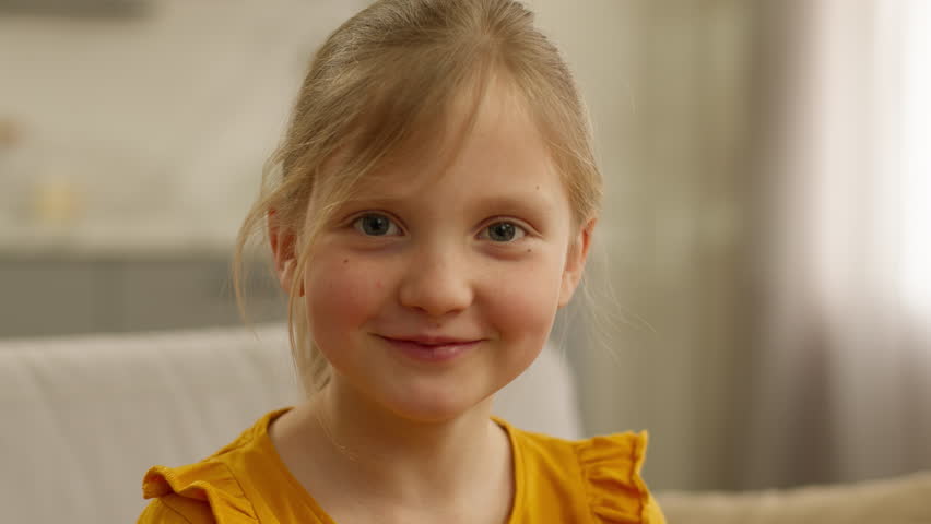 Portrait Caucasian little happy girl child kid daughter smiling looking at camera smile cute positive face laughing joy having fun laugh satisfied carefree baby headshot childhood innocence offspring