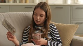 Caucasian little girl child kid daughter counting cash money dollar finance at home count studying financial education currency banking family budget savings calculating insurance loan mortgage bank - Powered by Shutterstock - Get 15% off with code: PIKWIZARD15