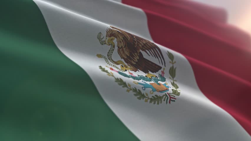 Flying national flag of North American country of Mexico. Waving national flag symbol of Mexico. National flag of Mexico with vertical green white and red stripes. Coat of arms. Banner