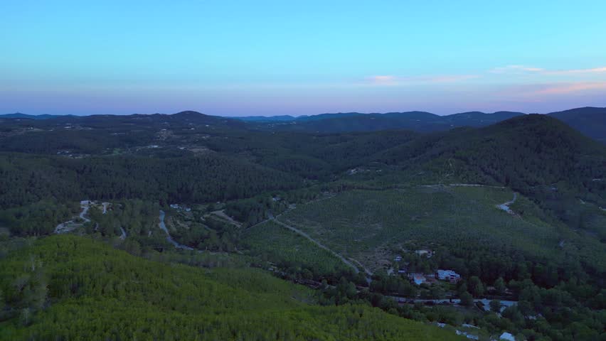 Ibiza Cala Benirras bay coastline at sunset. Lovely aerial view flight drone