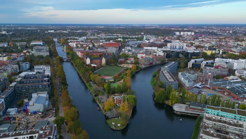 Berlin cityscape showing river soccer field. Unique aerial view flight drone