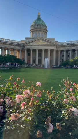 SAINT PETERSBURG, RUSSIA - October 17, 2025: Vertical video of Orthodox Kazan Cathedral, built in 1801 by architect A. Voronikhin in classical style with semicircular colonnade, on sunny autumn day