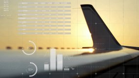 Sunset tail fin against sky while UI overlay fading in and pie charts spinning displaying data. Aviation, analytics, visualization, aerospace, technology, data, dashboard - Powered by Shutterstock - Get 15% off with code: PIKWIZARD15