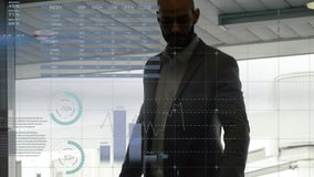 Businessman gripping suitcase handle by glass window and activating overlays for boarding flight. Corporate, travel, analytics, technology, airport, journey, professional - Powered by Shutterstock - Get 15% off with code: PIKWIZARD15