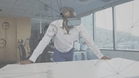Man securing VR headset leaning on table generating data web for tech insight colleague observing. Futuristic, innovation, technology, collaboration, digital, analytics, modern - Powered by Shutterstock - Get 15% off with code: PIKWIZARD15