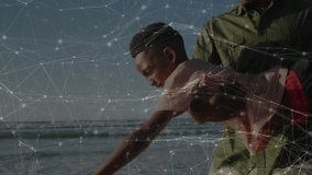 Father standing at shore holding son, mimicking flight swinging through surf under golden horizon. Bond, play, joy, adventure, nature, warmth, connection - Powered by Shutterstock - Get 15% off with code: PIKWIZARD15