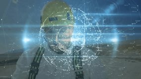 Mature engineer on wind farm site initiating network forming digital sphere around face for data. Technology, innovation, sustainability, digital, futurism, energy, industry - Powered by Shutterstock - Get 15% off with code: PIKWIZARD15