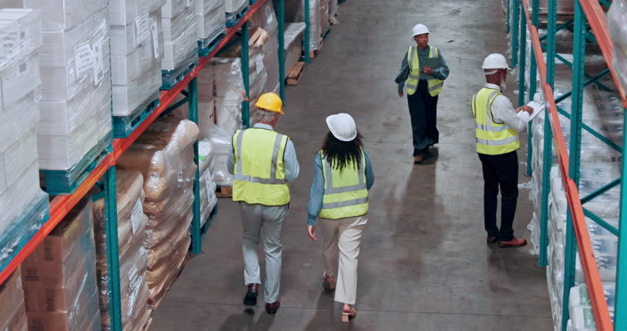 Above, supply chain and people in warehouse, handshake and storage inspection with export. Shaking hands, distribution and employees in factory, manufacturing and agreement for import and logistics