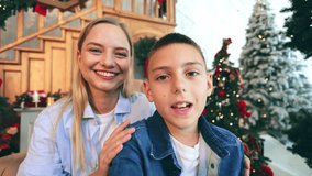 Cheerful family members enjoy video call, sharing happiness and smiles during the festive Christmas holidays. Radiant joy and warmth fill this holiday season moment. - Powered by Shutterstock - Get 15% off with code: PIKWIZARD15