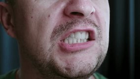 Close-up of a man brushing his teeth as part of his everyday routine. Problem with oral hygiene - Powered by Shutterstock - Get 15% off with code: PIKWIZARD15