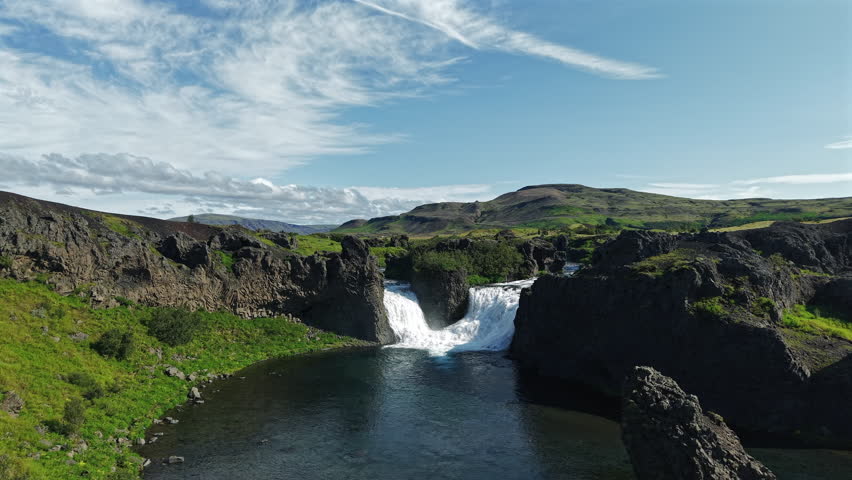 Hjalparfoss Waterfall with Basalt Rocks Iceland Drone View