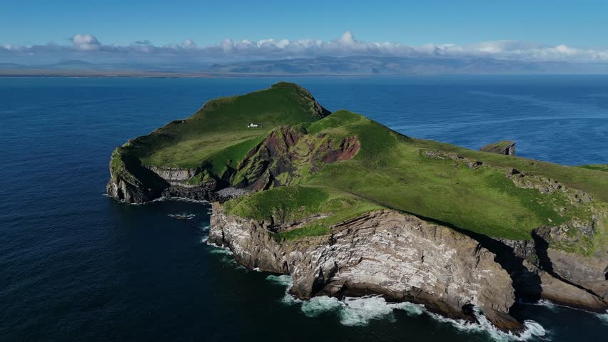 Small House on Rocky Island by the Sea
