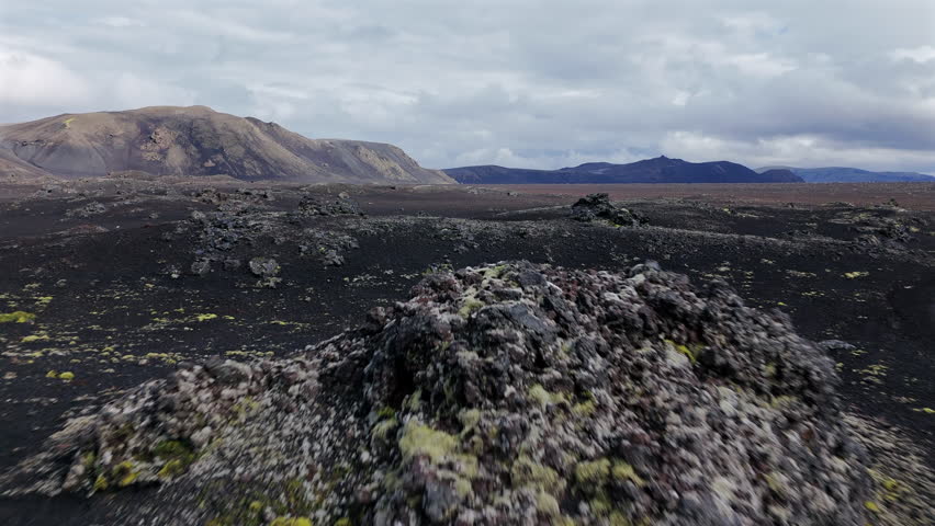 Flying Over Black Lava Rocks FPV View