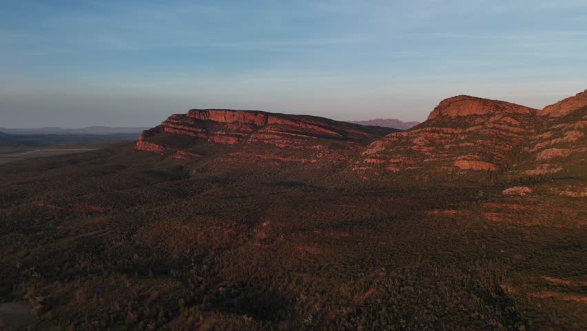 Flinders Ranges, South Australia at Sunrise – 4K Aerial Drone Footage of Rugged Mountains, Red Rocks, Green Valleys, and Golden Morning Light over the Outback Landscape