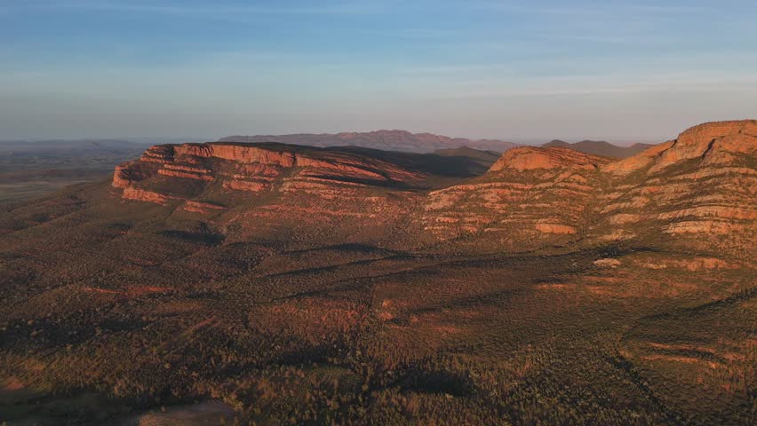 Flinders Ranges, South Australia at Sunrise – 4K Aerial Drone Footage of Rugged Mountains, Red Rocks, Green Valleys, and Golden Morning Light over the Outback Landscape