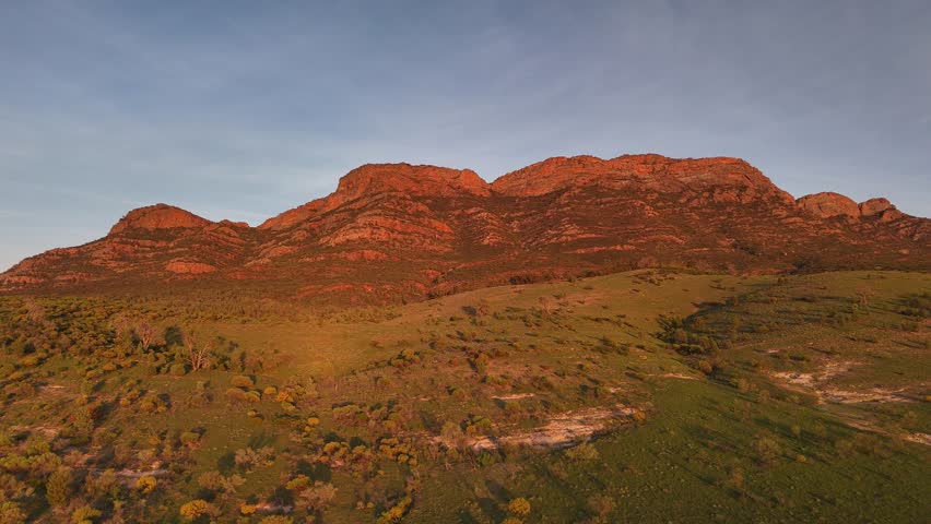 Flinders Ranges, South Australia at Sunrise – 4K Aerial Drone Footage of Rugged Mountains, Red Rocks, Green Valleys, and Golden Morning Light over the Outback Landscape