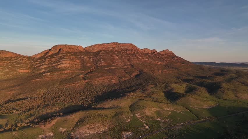 Flinders Ranges, South Australia at Sunrise – 4K Aerial Drone Footage of Rugged Mountains, Red Rocks, Green Valleys, and Golden Morning Light over the Outback Landscape