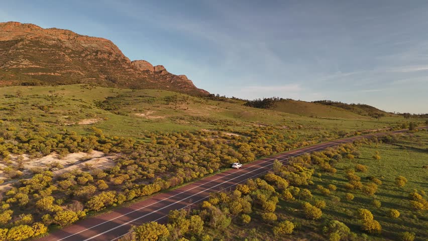 Flinders Ranges, South Australia at Sunrise – 4K Aerial Drone Footage of Rugged Mountains, Red Rocks, Green Valleys, and Golden Morning Light over the Outback Landscape