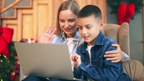 Smiling family members enjoy a virtual connection. Joyful holiday video call brings warmth and closeness. Celebrating Christmas with distant loved ones creates cherished memories and emotional bonds. - Powered by Shutterstock - Get 15% off with code: PIKWIZARD15