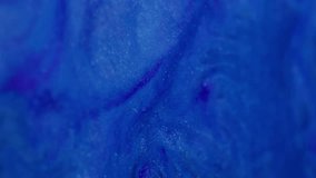 Vertical video. Wave art. Ink fluid. Defocused blue color water droplets sparkling spatter texture floating on abstract vivid background. - Powered by Shutterstock - Get 15% off with code: PIKWIZARD15