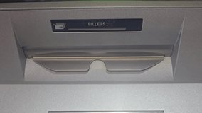 Closeup of ATM cash dispenser slot showing 20 euro note being withdrawn, banking concept - Powered by Shutterstock - Get 15% off with code: PIKWIZARD15