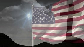 Sun flare appearing triggers breeze animating American flag billowing past cross for solemn mood. Patriotism, reverence, movement, outdoor, dramatic, spiritual, symbolic - Powered by Shutterstock - Get 15% off with code: PIKWIZARD15