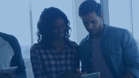 colleagues tapping tablet and phone, code overlay scrolling on glass wall for software review. Collaboration, teamwork, digital, technology, innovation, modern, communication - Powered by Shutterstock - Get 15% off with code: PIKWIZARD15
