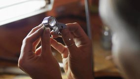 Mid-adult woman adjusting magnifying loupe over component, showing growing tech network user icons. Technology, innovation, craftsmanship, digital, connectivity, focus, precision - Powered by Shutterstock - Get 15% off with code: PIKWIZARD15
