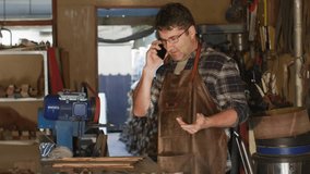 Woodworker answering call and activating floating media icons demonstrating woodworking progress. Craftsman, workshop, digital connectivity, innovation, craftsmanship, multitasking, modern technology - Powered by Shutterstock - Get 15% off with code: PIKWIZARD15
