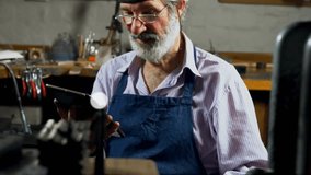 Senior craftsman tapping tablet, generating technology network overlay to explore device links. Technology, innovation, connectivity, digital, workshop, craftsmanship, professional - Powered by Shutterstock - Get 15% off with code: PIKWIZARD15