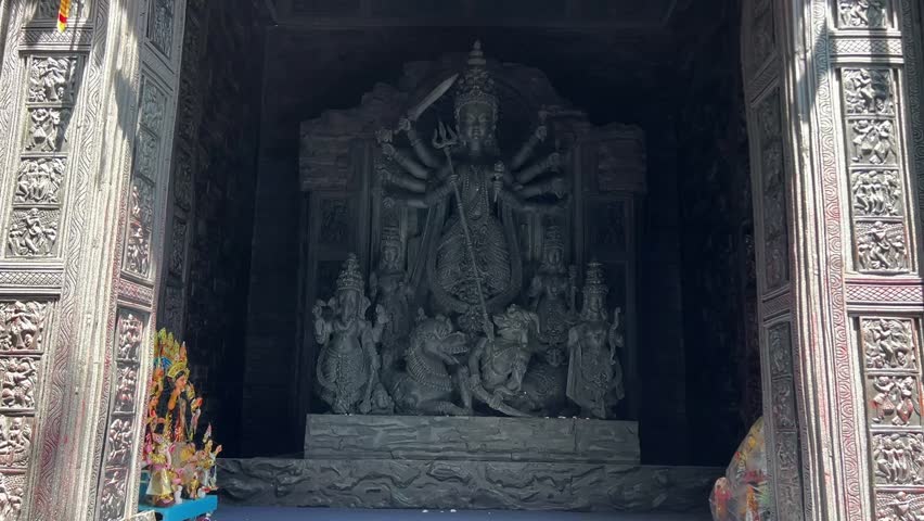 An old black stone Durga maa idol in Himalaya, India