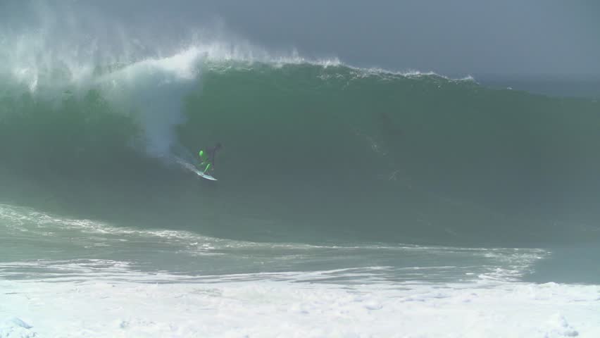 Surfer riding a perfect barrel wave at The Wedge