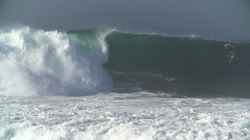 Surfer riding a perfect barrel wave at The Wedge