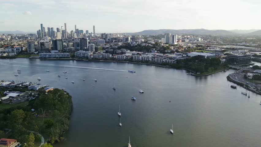  A collection of diverse aerial and time-lapse views of Brisbane, Queensland, Australia.Footage includes panoramic shots of the CBD skyline across the Brisbane River from various angles,