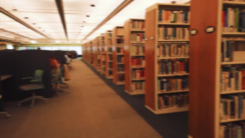 University of Waterloo, William G. Davis Computer Research Centre. Library, students studying in study areas with subdued artificial lighting. Waterloo, Ontario, Canada. Out of focus.