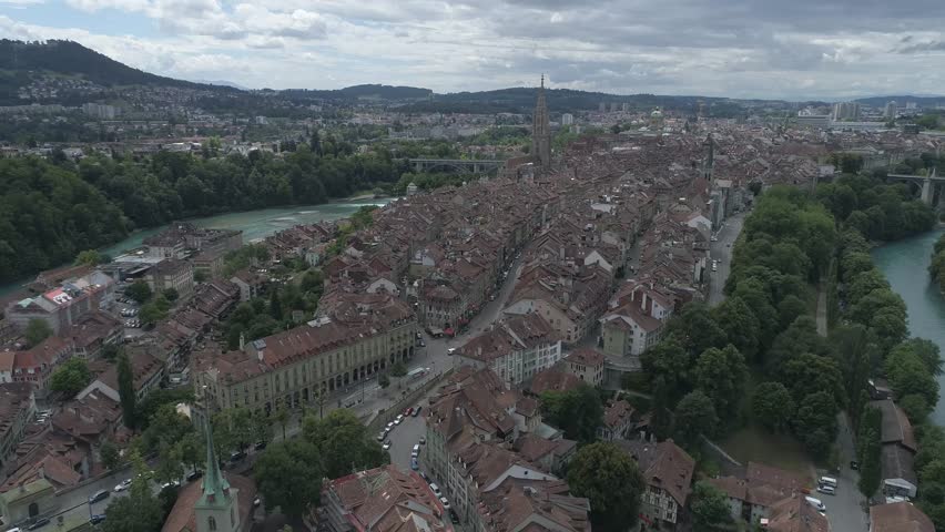 Aerial view of the old city with red roofs and the Aare river winding around the buildings, Bern, Canton of Bern, Switzerland.
