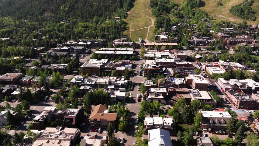 Aerial Pullback Reveals Resort Town of Aspen, Colorado on Summer Day