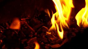 Glowing embers and rising flames inside hot grill, vivid fire texture and heat energy, slow motion - Powered by Shutterstock - Get 15% off with code: PIKWIZARD15