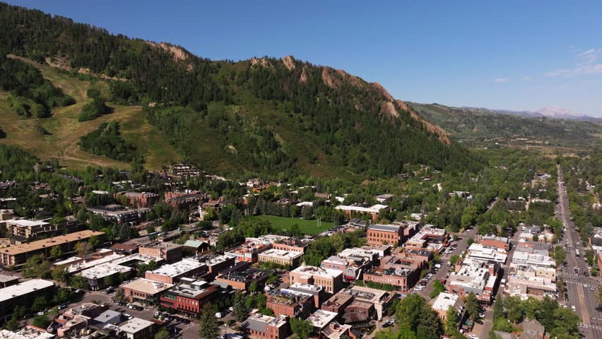 Drone Descends to Reveal Aspen, Colorado on Summer Day in Mountains