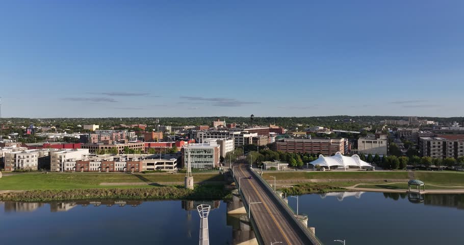 Aerial view of the bridge spanning the river with the city in the background, reflecting the bright blue sky, Dayton, Ohio, United States.