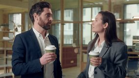 Happy multiethnic coworkers lunch break business man woman chatting drink coffee at office Korean ethnic businesswoman holding cup tea drinking beverage speaking work talk Caucasian businessman indoor - Powered by Shutterstock - Get 15% off with code: PIKWIZARD15