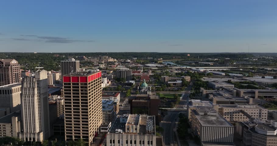 Aerial view of the cityscape with tall buildings and streets creating a contrast with the green spaces, Dayton, Ohio, United States.
