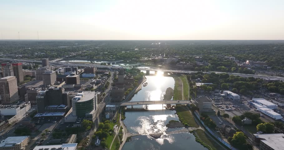 Aerial view of buildings and a river with bridges, capturing the contrast between urban structures and the flowing water, Dayton, Ohio, United States.