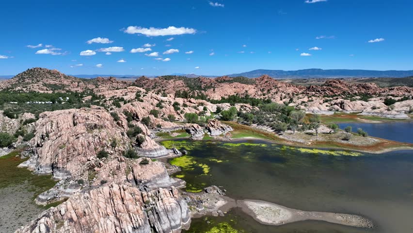 Aerial view of Willow Creek Reservoir with its rocky terrain, the water