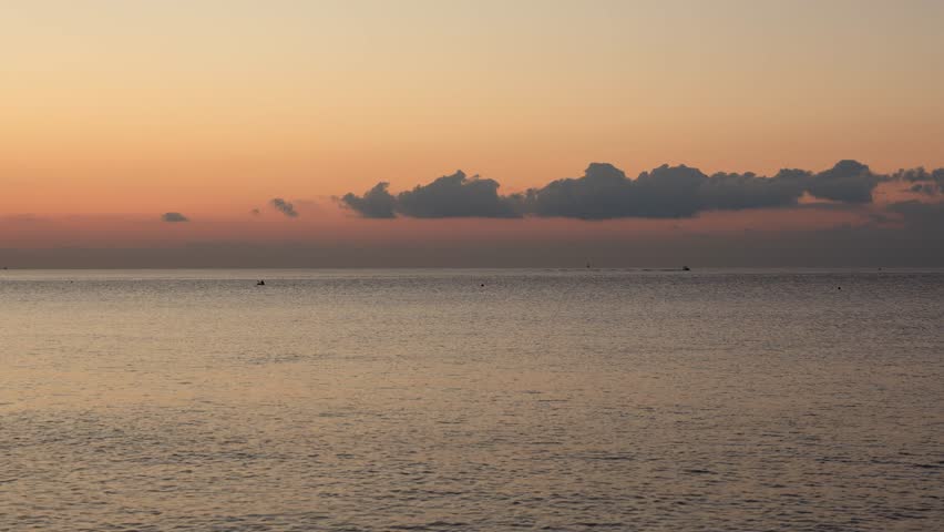 Red Morning Sky Reflecting on the Calm Sea