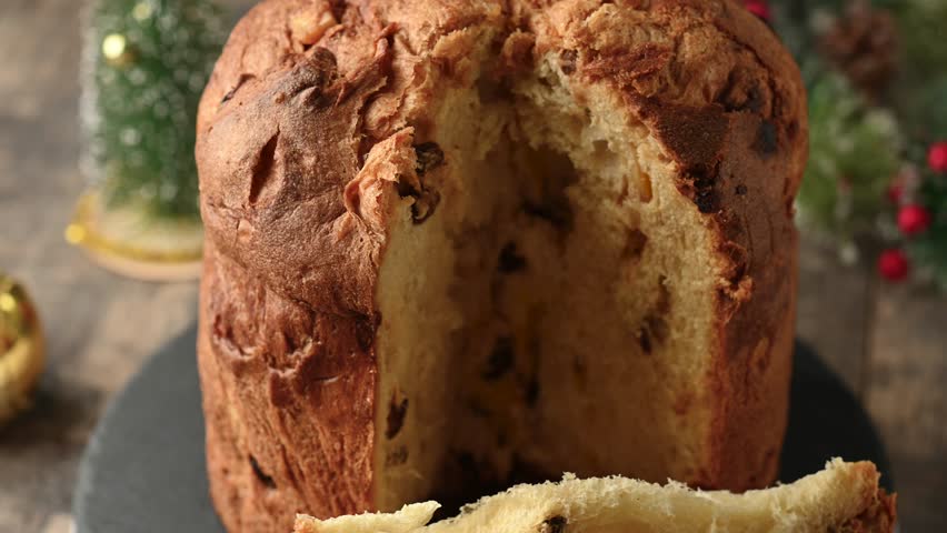 Traditional fruit panettone on wooden table