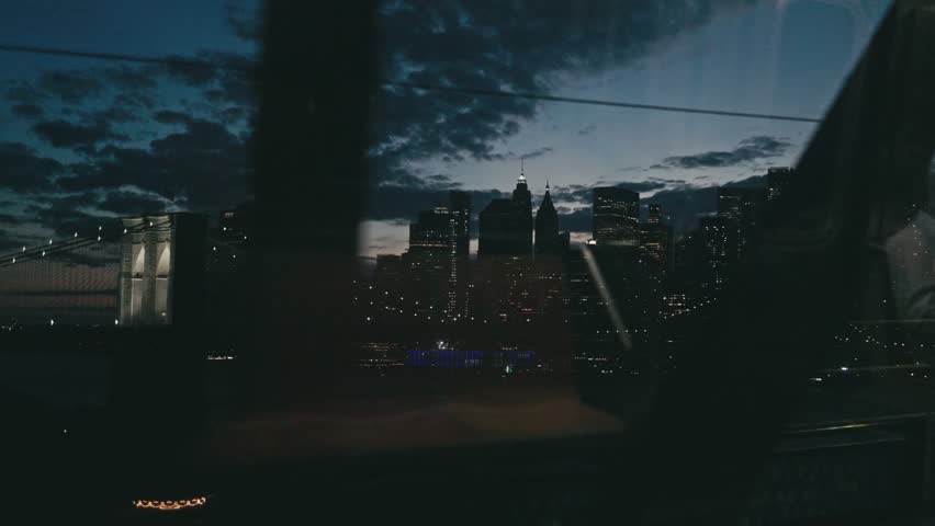 New York City Skyline at Night from Moving Train Window