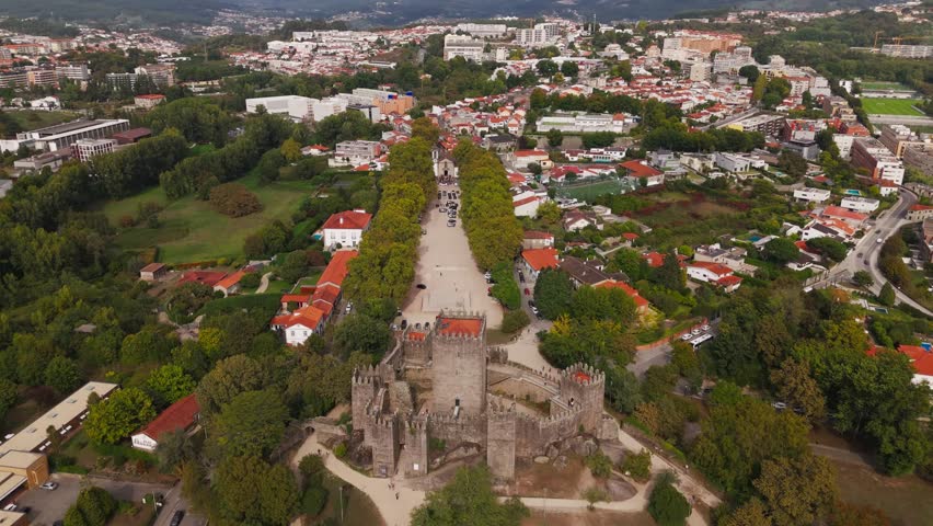 Drone - Guimarães Castle with cityscape and green surroundings in Portugal
