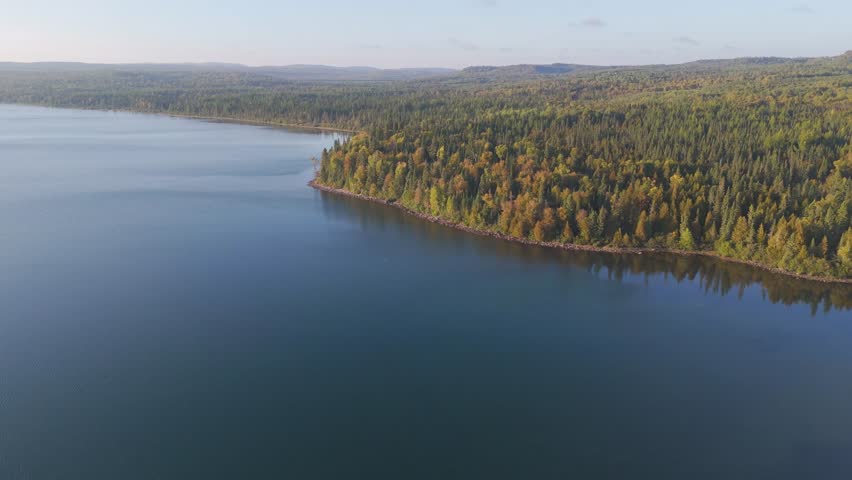 Shores of Lake Superior and forest meet the lake in Ontario, Canada